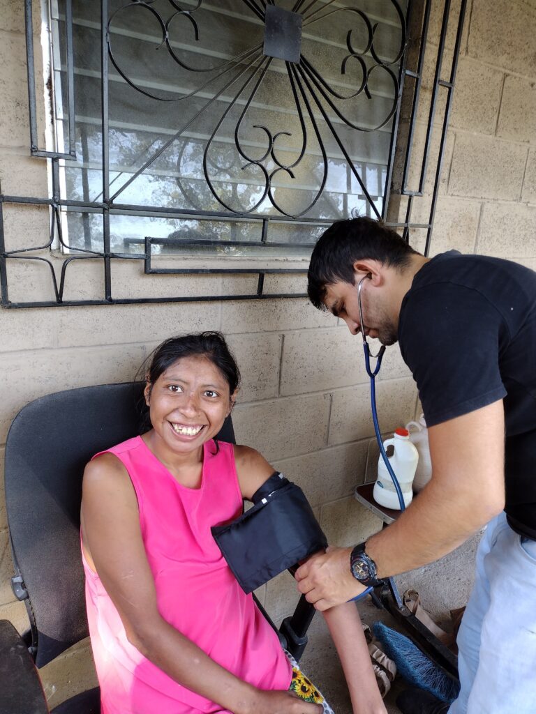 Dr. Granados taking Veronica's blood pressure